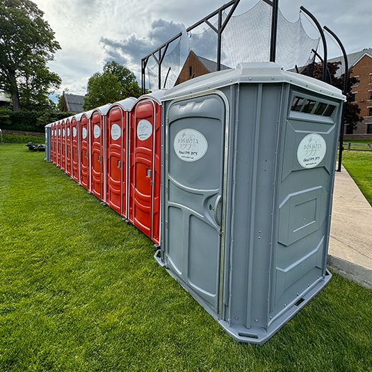 Bonavita Site Solutions - Portable restrooms lined up at an outdoor sporting event