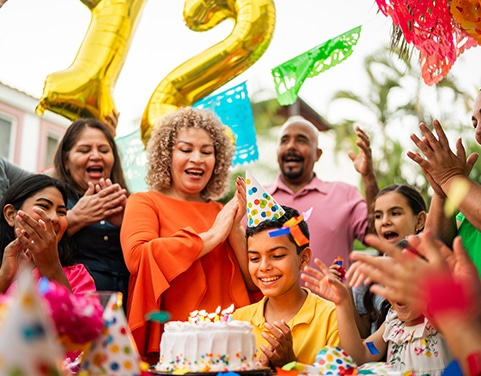 Outdoor birthday party family cheering