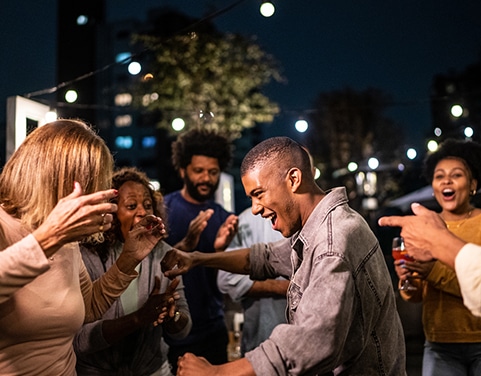 Late evening surprise birthday party dancing crowd